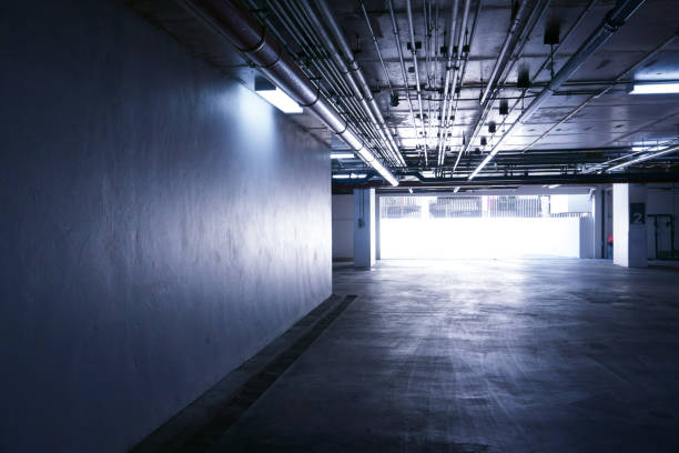 istock Sanitary system pipes and electrical cables installed under flat slab reinforced concrete structure in building.Ventilation pipes in Underground Parking 1421363021