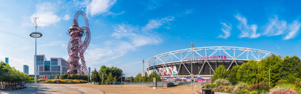 Anish Kapoor’s ArcelorMittal Orbit sculpture overlooking the London Stadium, home of West Ham Football Club, in the Queen Elizabeth Olympic Park in London, UK.