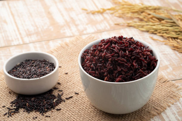 istock Cooked brown rice or riceberry rice in white bowl 1421374314