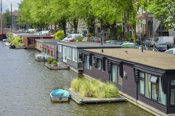 Typical floating houses in a Canal of Amsterdam.