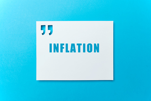 White card with quotation mark where Inflation is written on blue background.
