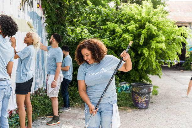 istock Hispanic woman prepares her paint roller 1421375882
