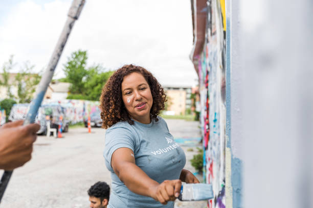 istock Mid adult woman paints 1421375892