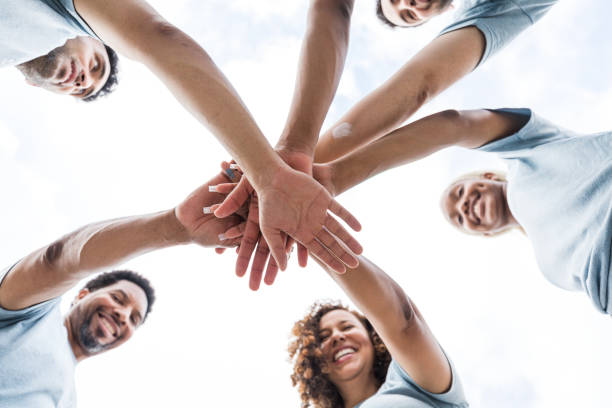 istock Volunteers put their hands in 1421375934