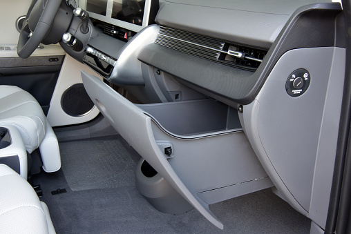 Glove box on the console of a passenger car. Compartment in front of the passenger.