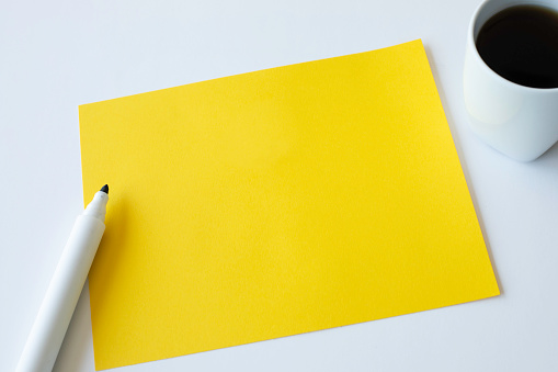 Blank yellow paper on the desk.