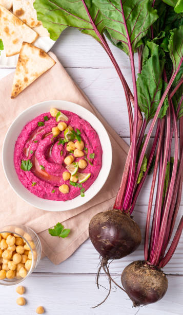 istock Homemade Beetroot hummus on white table, top view 1421382800