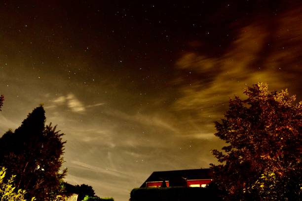istock Starry sky in a long term picture with clouds 1421384268