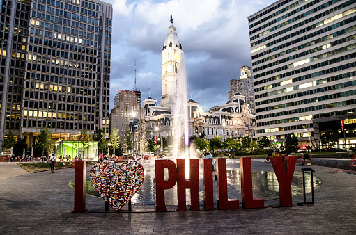 I love Philly sign and fountain at the Philadelphia Love Park during summer evening