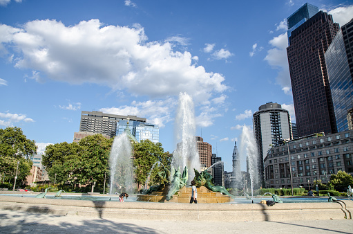 Swann Memorial fountain in Philadelphia Logan Square during summer day with building in background