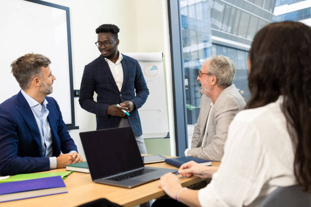 istock Businesspeople having a briefing 1421387256