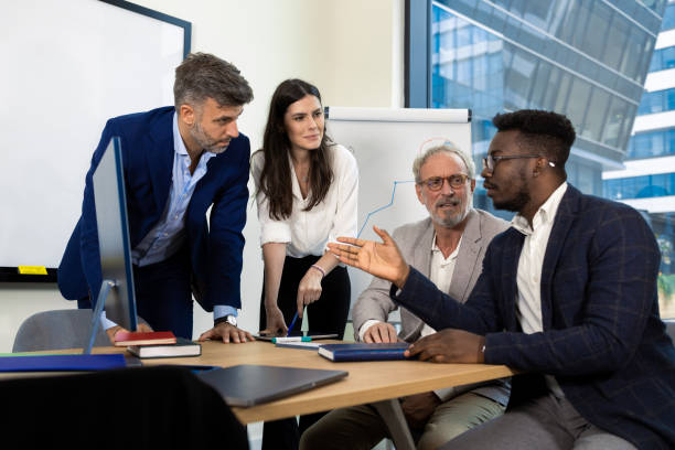 istock Businesspeople having a briefing 1421387390