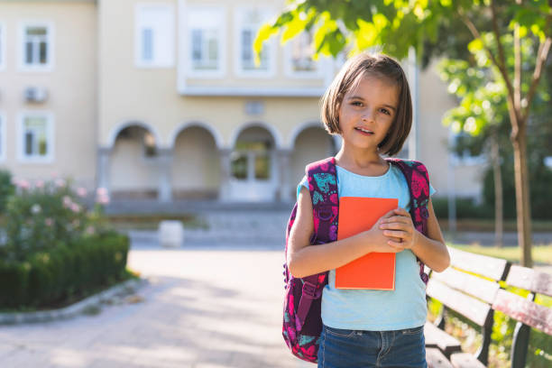Free Stock Photo of Portrait of Cute Little Girl with Book and Backpack ...