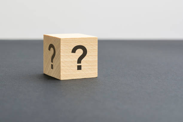 istock wooden block with question marks on black background, business teamwork concept 1421395516