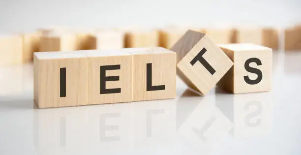 wooden blocks with the text: ielts - International English Language Testing System