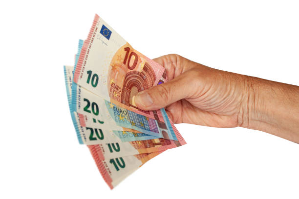 istock Hand holding range of Euro banknotes. 1421401846