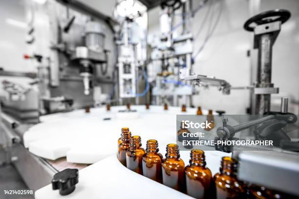 Focus On Brown Bottles Perfectly Arranged In A Pharmaceutical Laboratory Stock Photo - Download Image Now