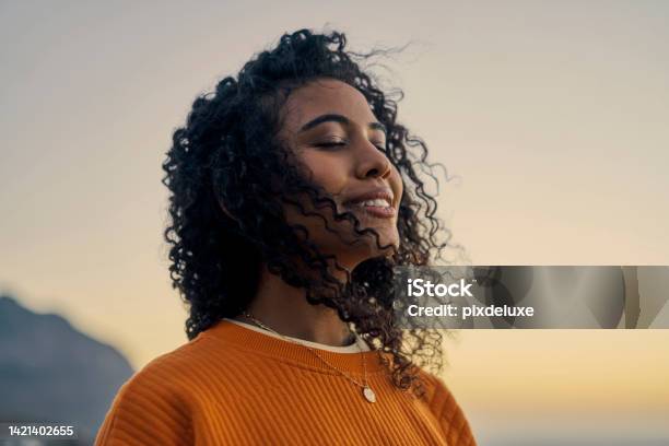 Happy Woman In Nature Sunset Sky Peace And Smile Breathing Co2 Wellness Beauty Clear Outdoor Sky And Fresh Wave Of Calm Eyes Closed Asthma Treatment Air And Girl With Curly Hair Relaxed Face Stock Photo - Download Image Now