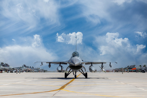 Beja, Portugal: parked General Dynamics F-16 Fighting Falcons of the Portuguese Air Force - in the foreground a twin-seat F-16 BM version, the rest are F16 AMs - equipped with external fuel tanks - Beja Airport serves both civil and military aviation.