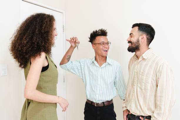 istock Real estate agent serving same-sex couple 1421408555