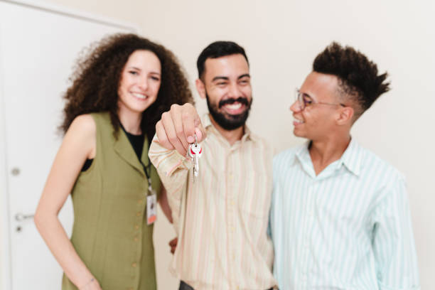 istock Real estate agent serving same-sex couple 1421408610