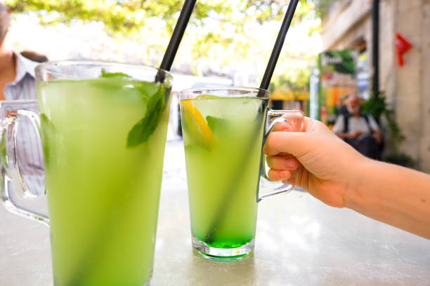 istock Fresh lemonade or mojito cocktail with mint on the table. 1421410750
