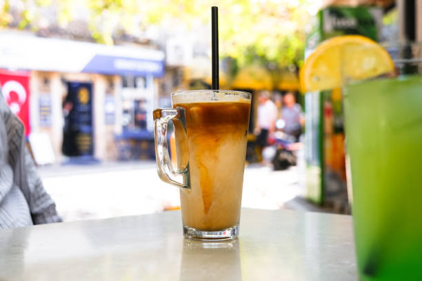 istock Ice latte coffee with a straw on the table. 1421410764