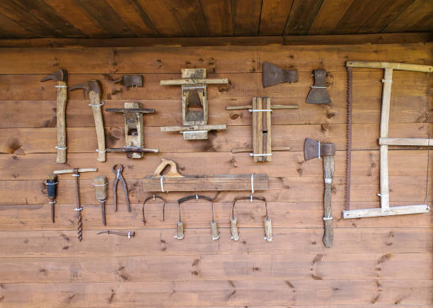 istock Top view of old woodworking tools, axe, planer, saw. Tools neatly arranged 1421412129