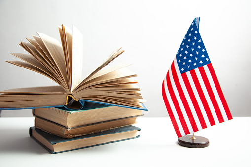 Education concept, Stack of books with American flag