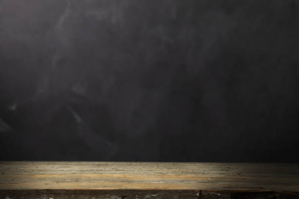 istock Wood table with blackboard background 1421413798