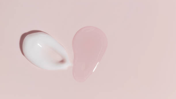 istock Banner cosmetic smears cream texture on pastel pink background 1421415842