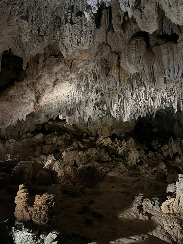inside of a cave with a large gallery full of stalagmites and stalactites, erosion and geology, urdax cave, Navarra, Spain, portrait