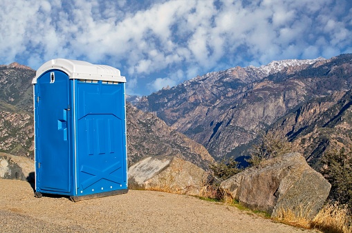 Porta Potty with a view in King's Canyon national park California. Sometimes in the most remote sections and beautiful areas the portable latrines offer the best scenic views. A humorous look with copy space.