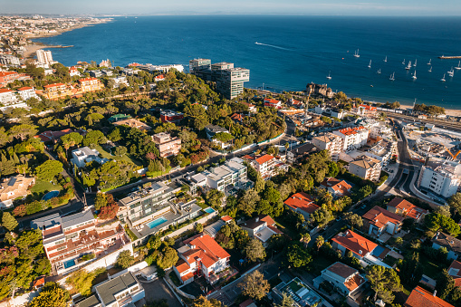 Aerial drone view of Avenida Brasil in Cascais, Portugal, one of the most expensive street in Portugal overlooking Cascais Bay