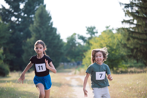 Children running race. Cross country running. Active and healthy lifestyle. Running as a sport.