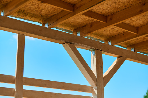 Wooden frame of rafters for the ceiling of the canopy from the sun and rain