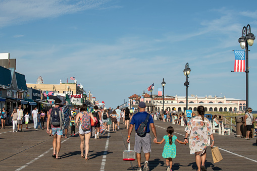 Ocean City, USA - September 3, 2022. People walking on boardwalk, Ocean City, New Jersey, USA