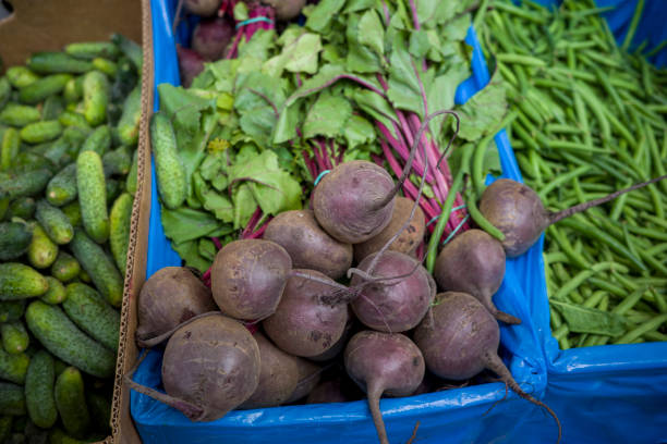 red beets in boxes, vegetables on the market counter, shot close-up