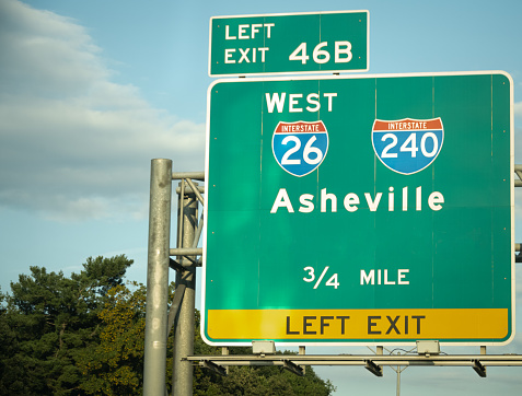 Highway signs lead drivers to Asheville, NC, USA.