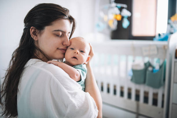 istock Mom embracing her little baby boy. 1421439263