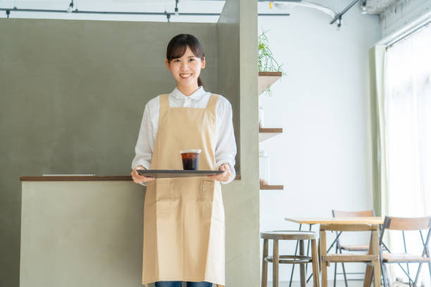 woman working in a cafe stock photo