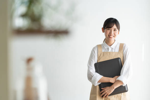 istock woman with a tray in a cafe 1421441687