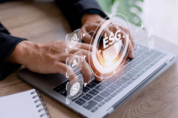 istock Businessman using a computer for analysis ESG environmental social governance business strategy investing concept. 1421442634