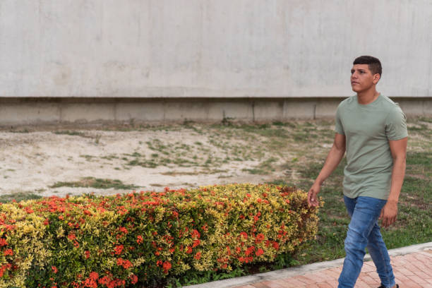 istock Man with freckles walking in the park 1421444937