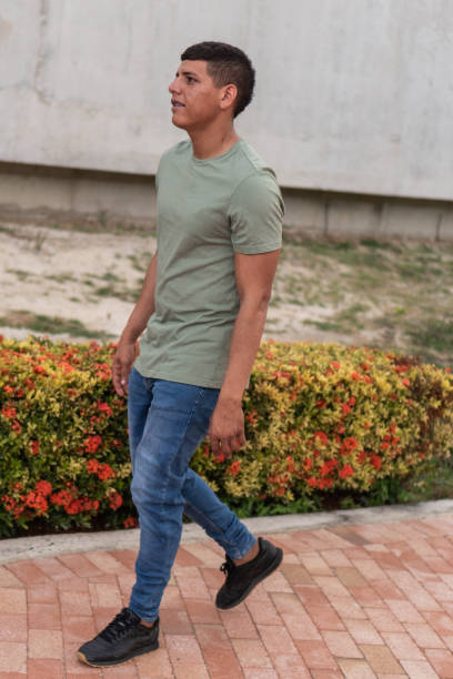 istock Latin Man walking in the park 1421444954