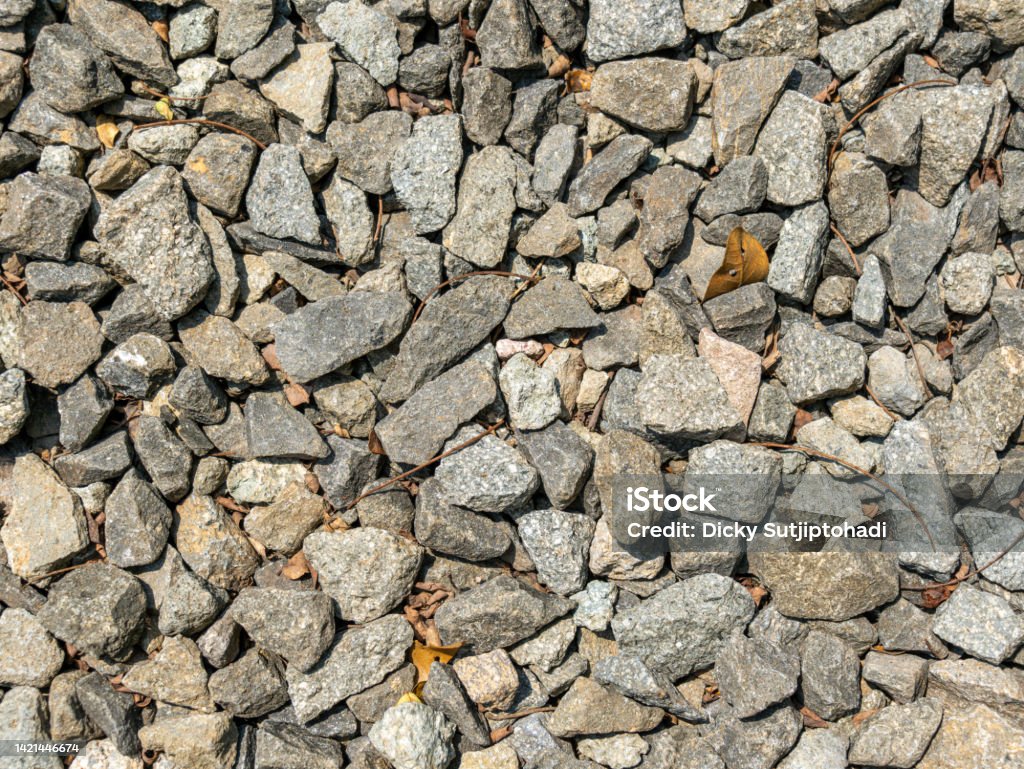 An Overlay of Grey Pebbles Texture An overlay of grey pebbles with rich textures and high resolution. Abstract Stock Photo