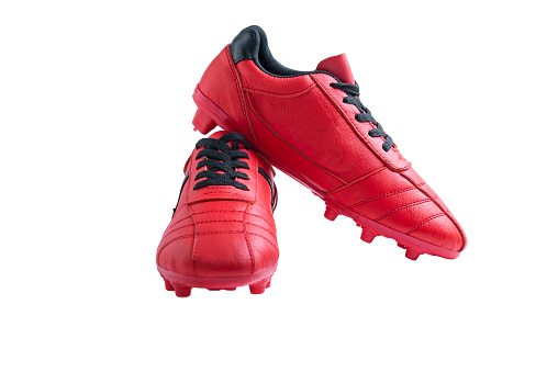 Red football shoes isolated over white background