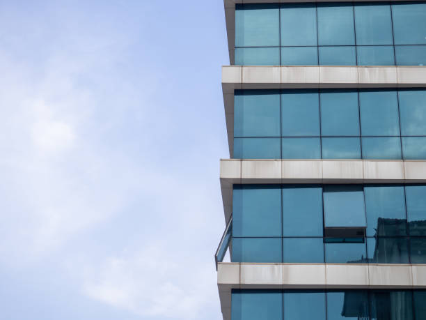 istock The sky is reflected in the windows. Turkey. glazed windows. Modern urban architecture. Office building. Part of the house. 1421447862