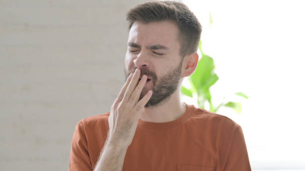 istock Sleepy Young Man Yawning, Need Rest 1421453553