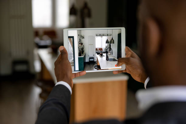istock Real estate agent making a virtual tour of a house using a tablet 1421456355